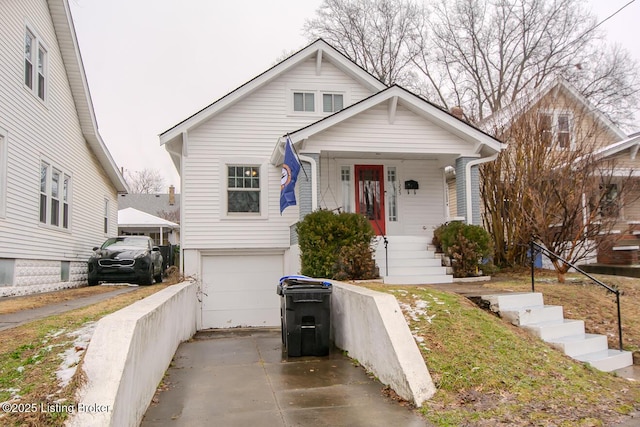 view of front of property with a garage and covered porch