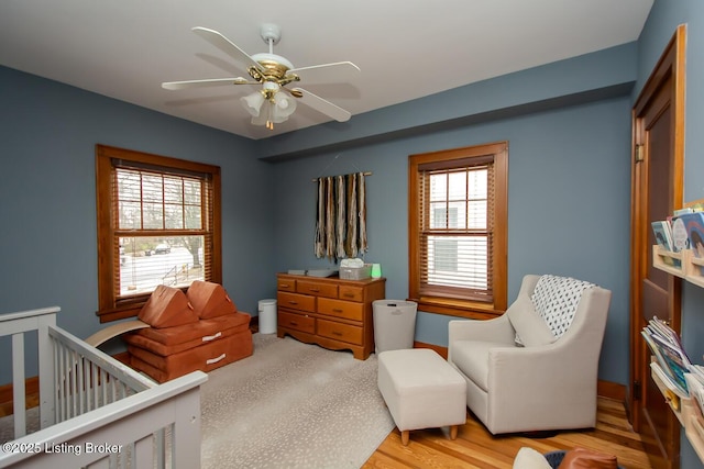 bedroom featuring light hardwood / wood-style floors and ceiling fan