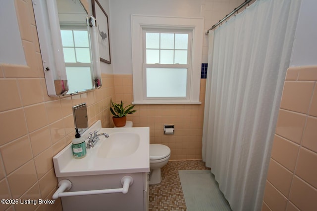 bathroom featuring a shower with curtain, vanity, tile walls, and toilet