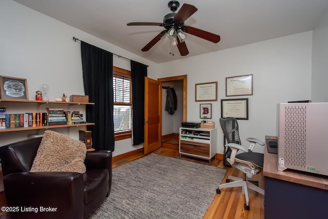 office featuring wood-type flooring and ceiling fan