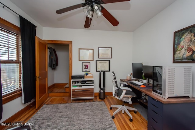 office featuring hardwood / wood-style flooring and ceiling fan