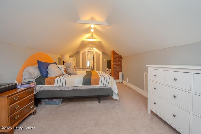 carpeted bedroom featuring vaulted ceiling