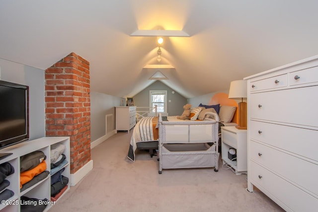 carpeted bedroom with vaulted ceiling