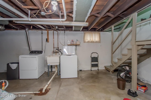 basement featuring sink and washer and clothes dryer