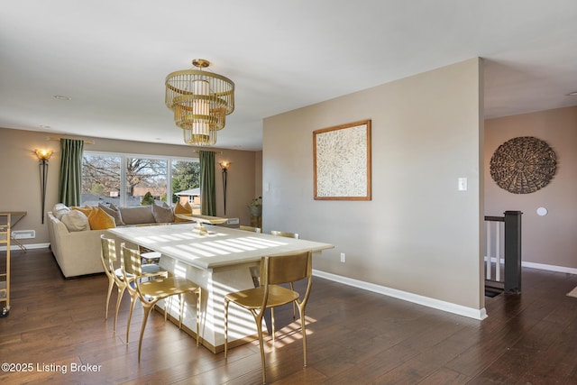 dining space featuring dark wood-type flooring and a chandelier