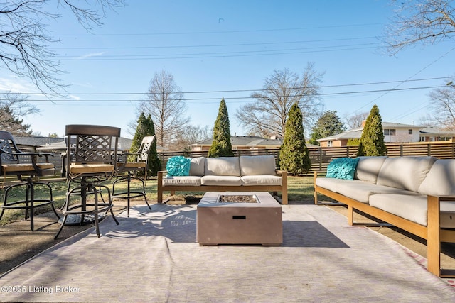 view of patio featuring an outdoor living space with a fire pit