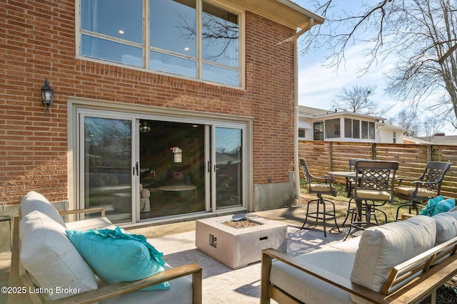 view of patio / terrace with an outdoor living space with a fire pit