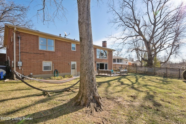 back of property featuring a lawn