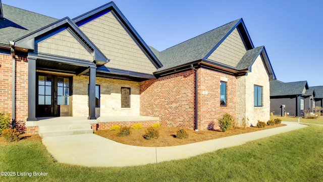 view of front of house with covered porch and a front yard