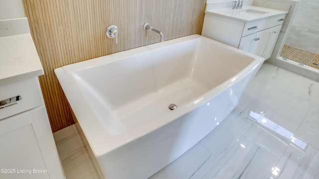 bathroom with vanity and separate shower and tub