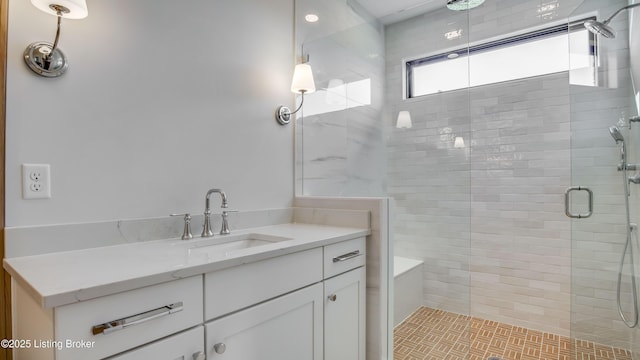 bathroom with vanity and walk in shower