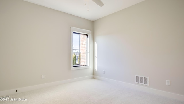 carpeted empty room with ceiling fan