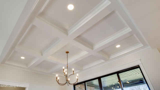 details featuring beamed ceiling, coffered ceiling, and a chandelier