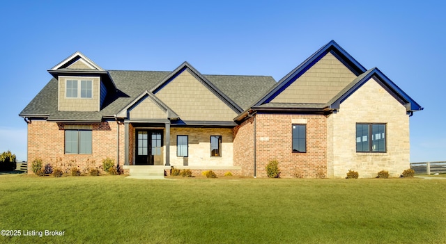 craftsman-style house with a front yard