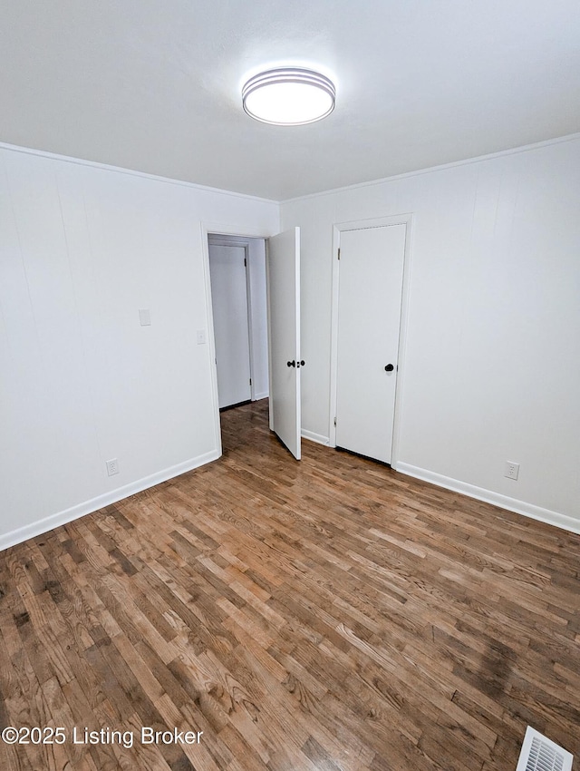 empty room featuring hardwood / wood-style floors