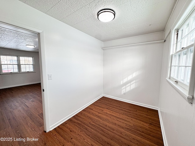 unfurnished room featuring dark hardwood / wood-style flooring