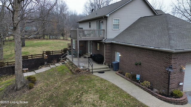 view of side of property with a lawn