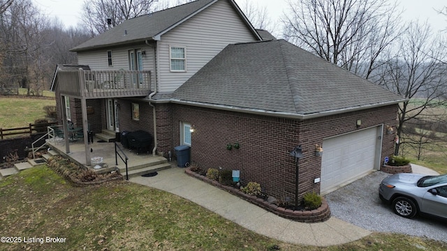 view of home's exterior featuring a garage and a yard