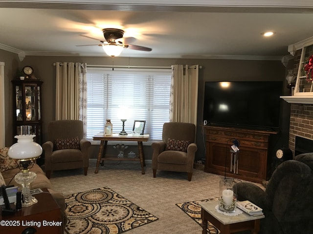 carpeted living room with crown molding, ceiling fan, and a brick fireplace