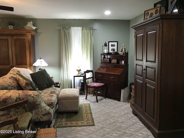 living area featuring carpet flooring