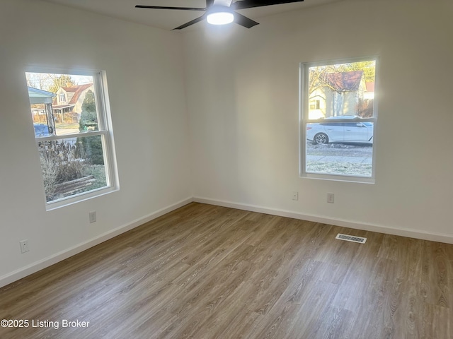 unfurnished room featuring ceiling fan and light hardwood / wood-style flooring