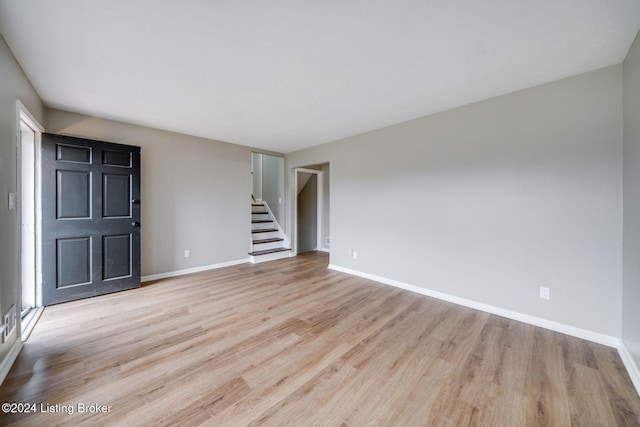 unfurnished room featuring light hardwood / wood-style floors