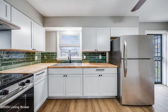 kitchen featuring white cabinetry and stainless steel appliances