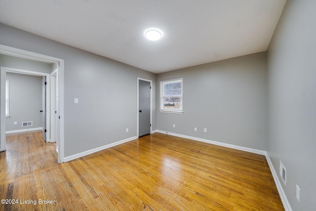 empty room with wood-type flooring