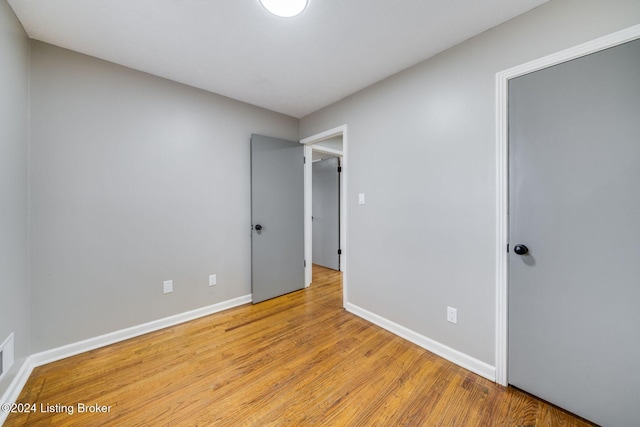 unfurnished room with light hardwood / wood-style flooring