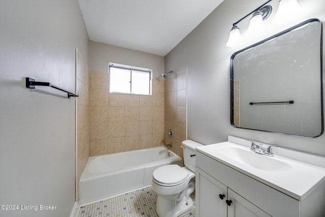 full bathroom featuring tiled shower / bath, vanity, toilet, and tile patterned flooring