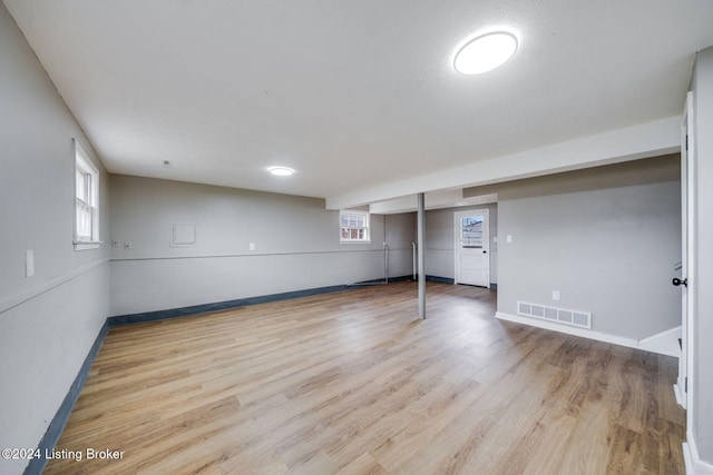 basement featuring light hardwood / wood-style flooring