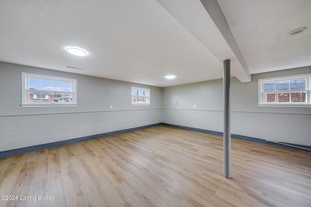 basement featuring light hardwood / wood-style floors