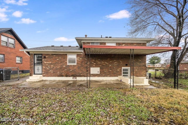 back of property featuring a patio area