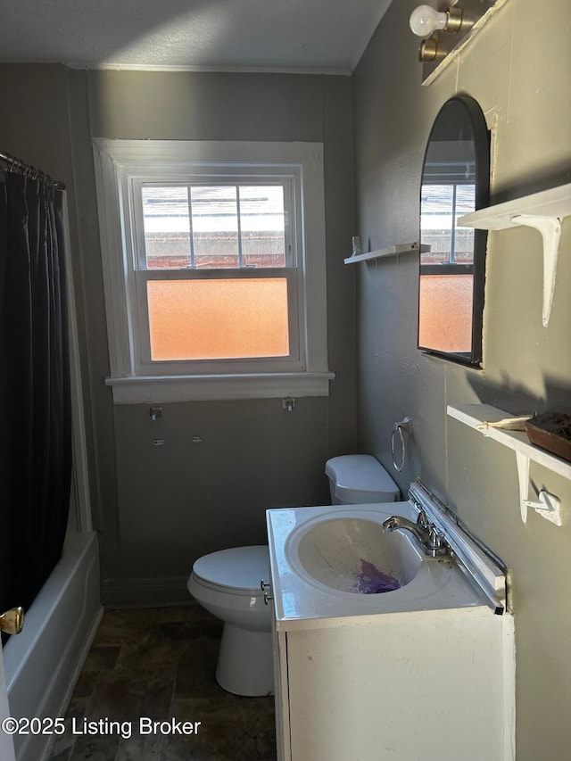 full bathroom with toilet, vanity, and shower / bathtub combination with curtain