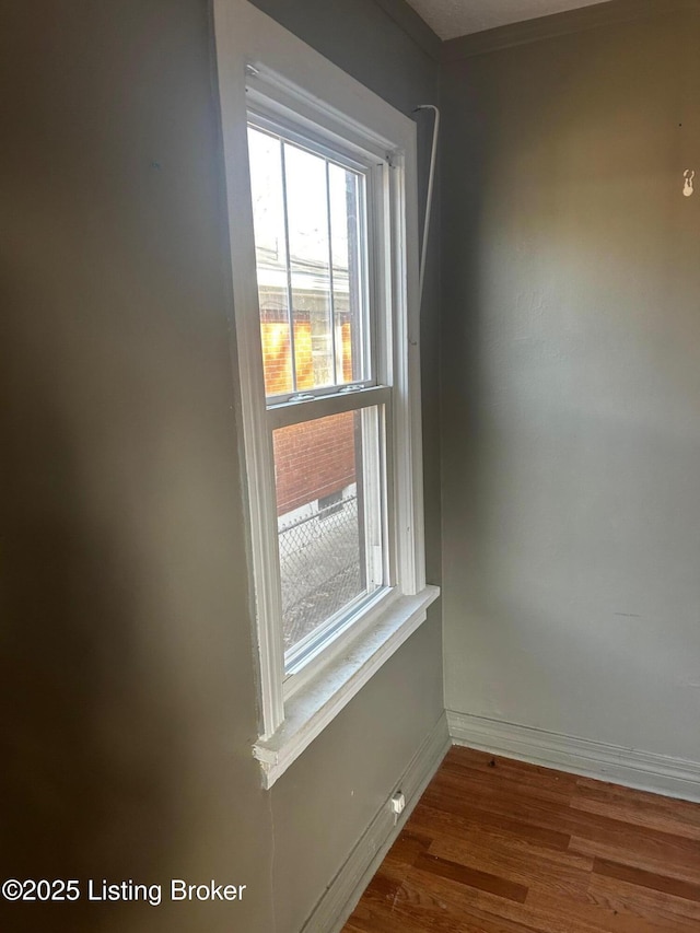 unfurnished room with wood-type flooring