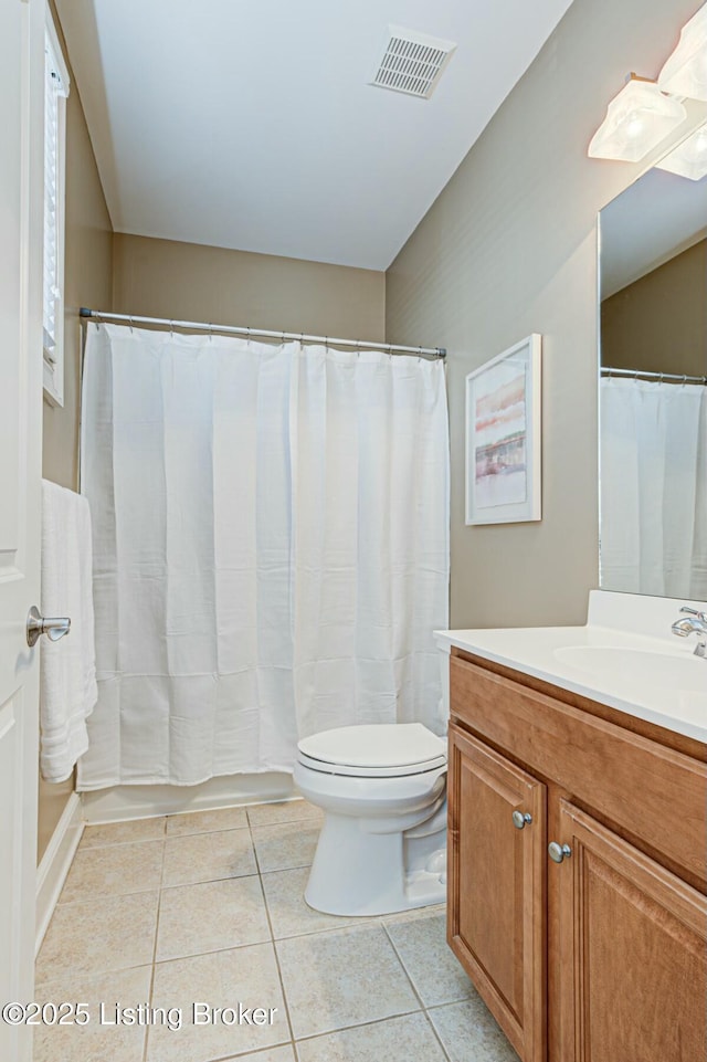 bathroom featuring visible vents, a shower with shower curtain, toilet, vanity, and tile patterned floors