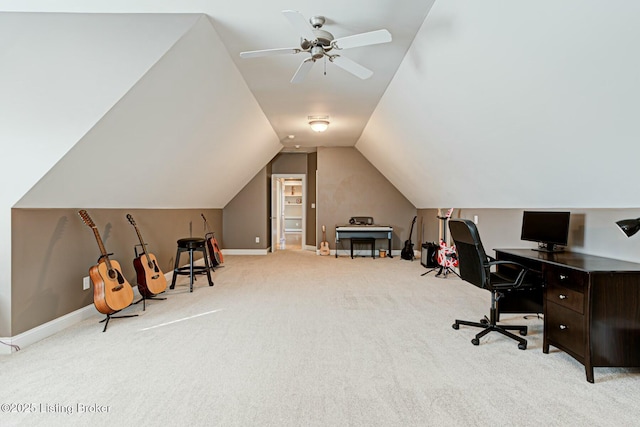 home office featuring light carpet, ceiling fan, baseboards, and lofted ceiling