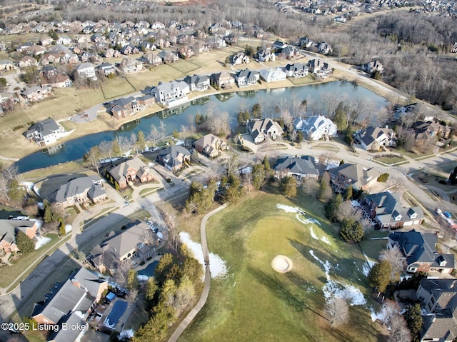 birds eye view of property featuring a water view and a residential view