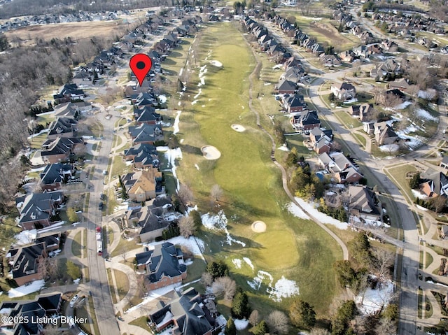 birds eye view of property featuring view of golf course and a residential view