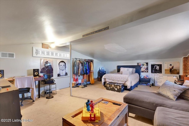 bedroom featuring lofted ceiling and carpet floors