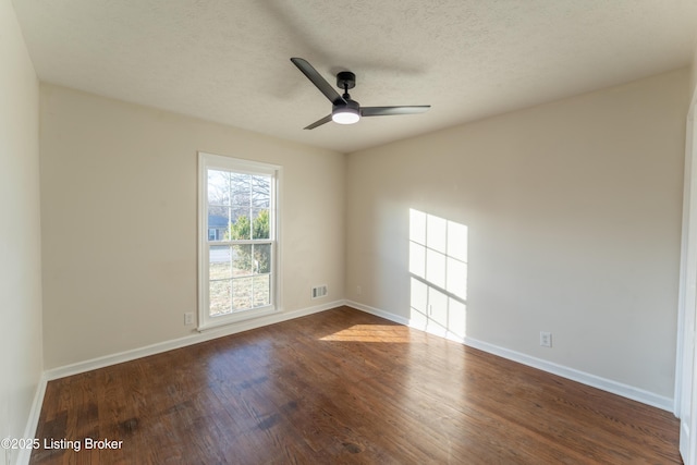 spare room featuring hardwood / wood-style floors, a textured ceiling, and ceiling fan