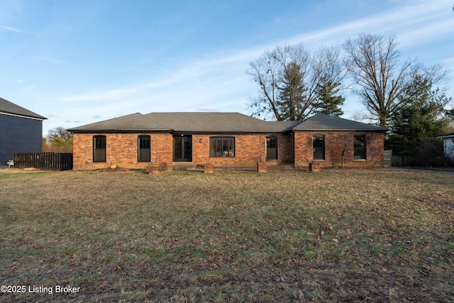 ranch-style home with a front yard