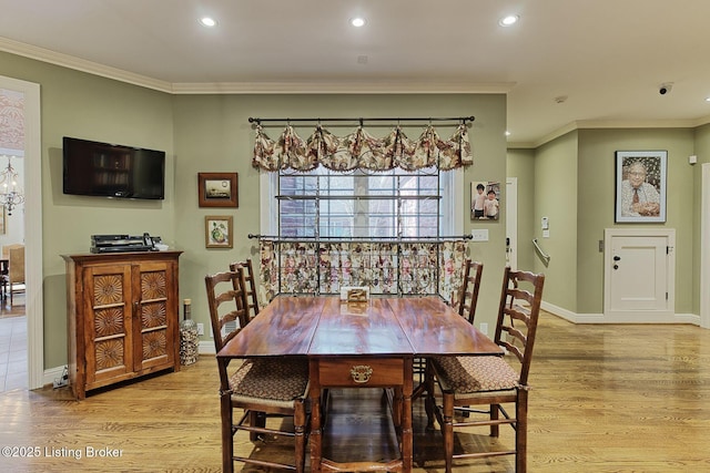 dining area featuring baseboards, ornamental molding, light wood-type flooring, and recessed lighting