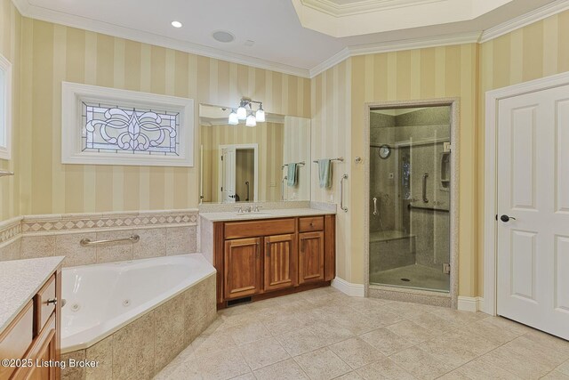 full bathroom featuring vanity, ornamental molding, a tub with jets, a stall shower, and wallpapered walls