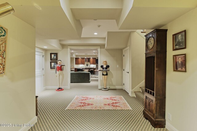 corridor featuring recessed lighting, carpet, and baseboards