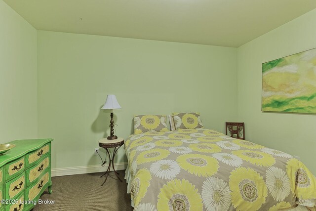 bedroom with carpet flooring and baseboards