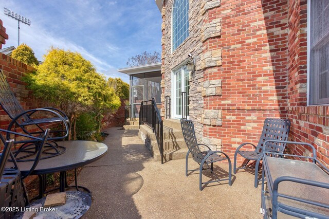 view of patio / terrace with a sunroom