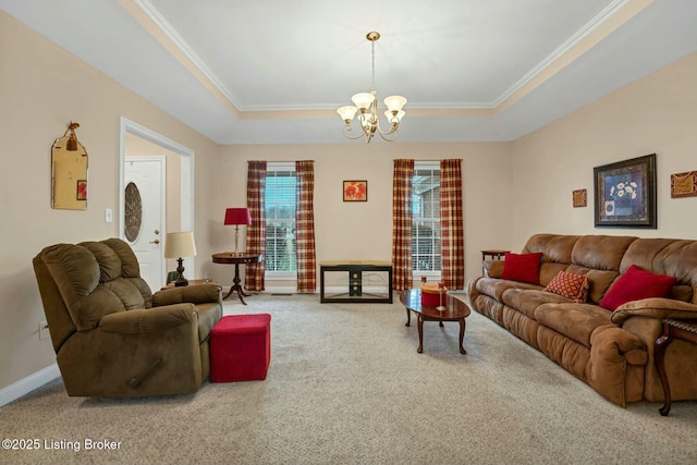 living room featuring crown molding, a raised ceiling, and carpet