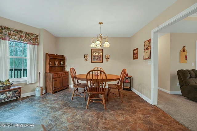 carpeted dining area featuring an inviting chandelier