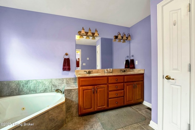 bathroom featuring vanity, tile patterned floors, and tiled bath